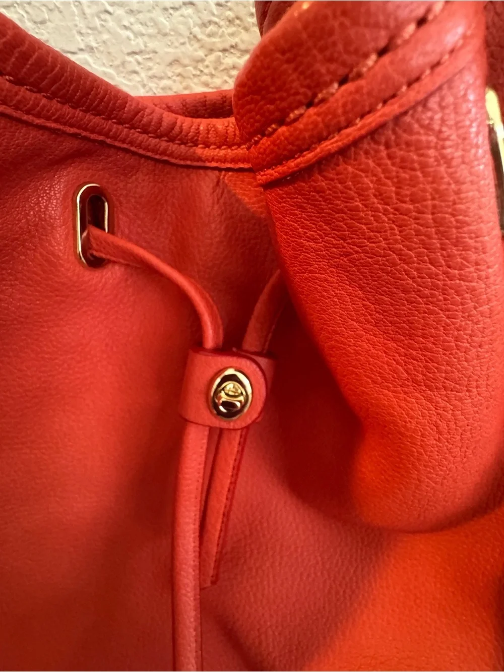 Coach Twist Lock Coral-Orange Pebbled Leather Drawstring Shoulder Bag